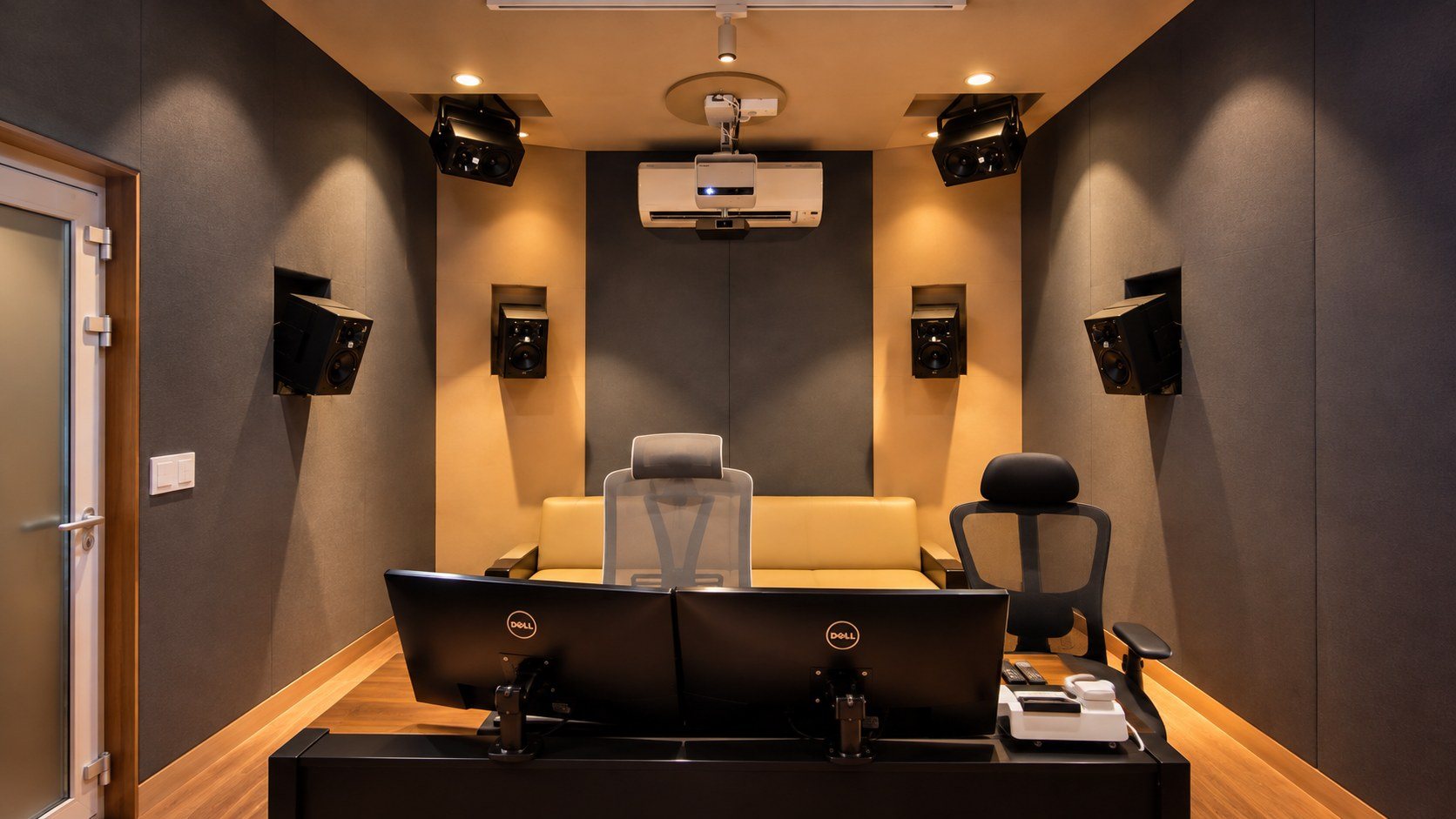 The STUDIO25 7.1.4 Dolby Atmos room, looking back past the mix position to the surround and overhead speakers